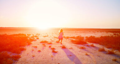girl in the desert at the  sunset