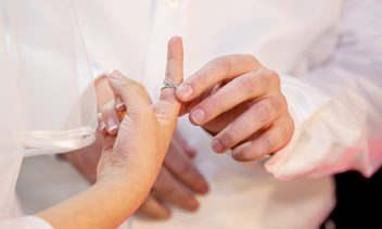 Jewish wedding. Jewish groom puts a ring on the finger of a Jewi