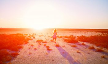 girl in the desert at the  sunset